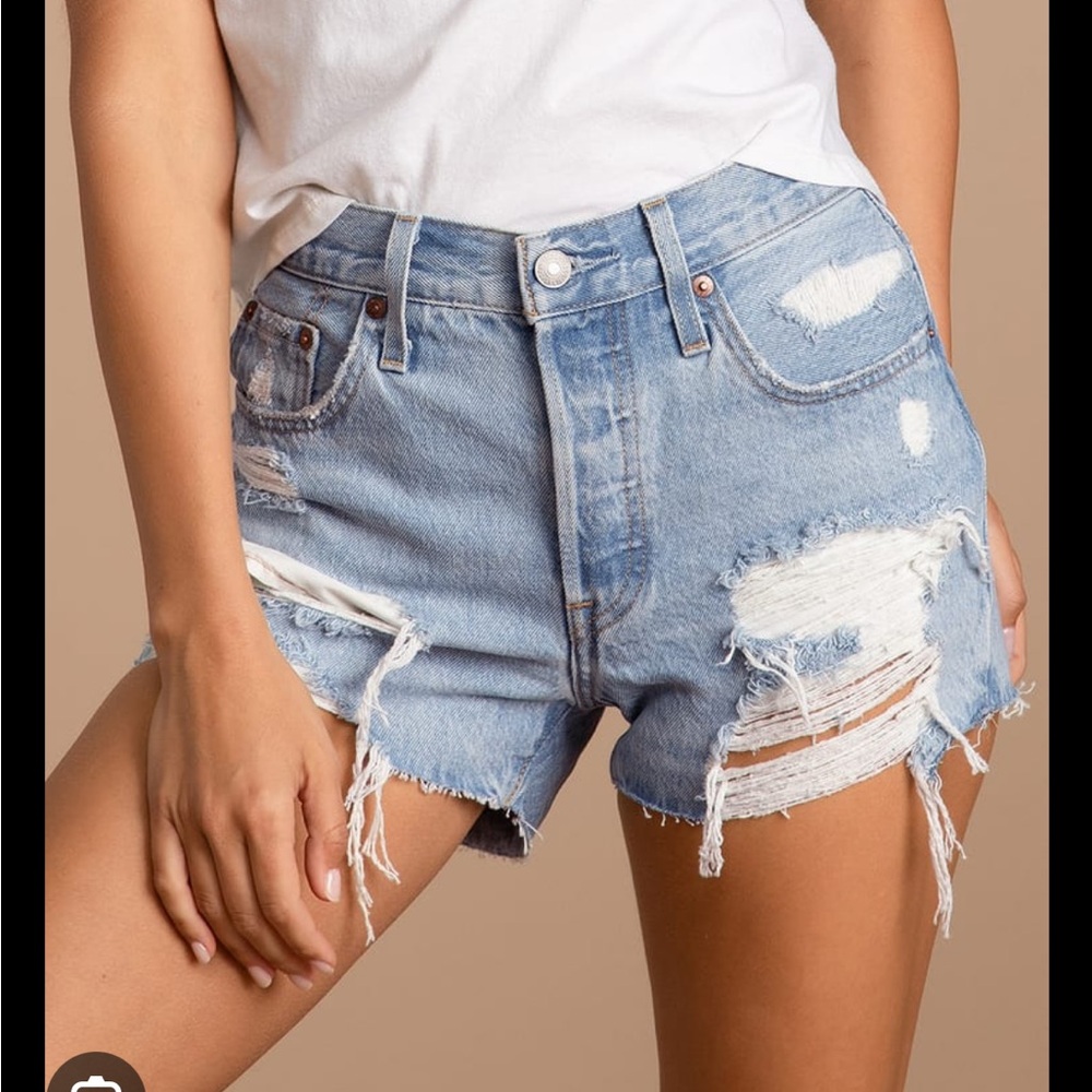 Levi’s 501 light wash distressed high rise cutoff denim shorts